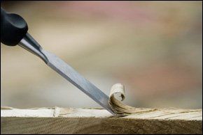  Carpenters chisel cutting into soft wood in Northern Ireland