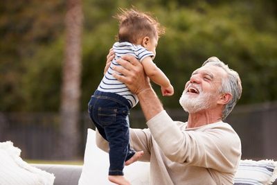 Senior Man Lifting His Baby Grandson — Lima, OH — Beery Insurance