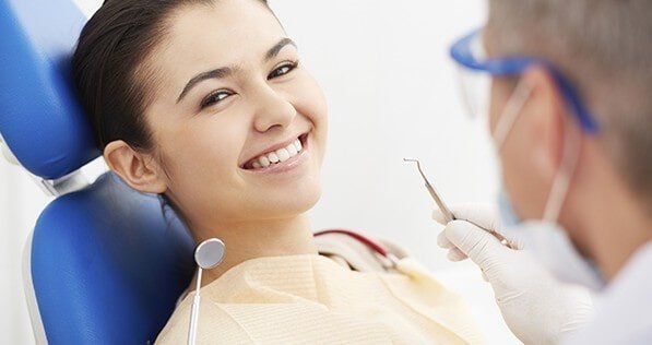 Smiling Woman with Dentist - Comprehensive Dental Services in Hampton, VA Smiling Woman with Dentist - Comprehensive Dental Services in Hampton, VA