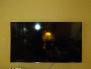 TV Mounted on Yellow Wall — Decatur, AL — Operation Handyman TV Mounted on Yellow Wall — Decatur, AL — Operation Handyman