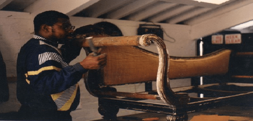 royal looking chair being restored and polished