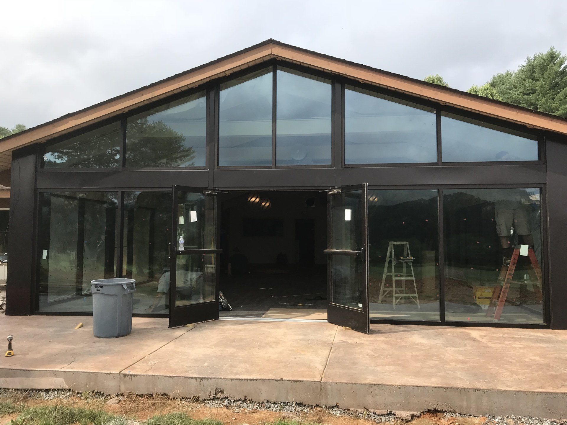Modern commercial building with large glass doors and windows.