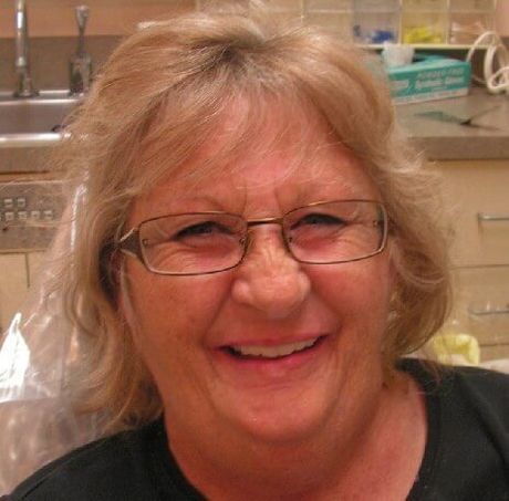 smiles for the camera with full arch dental implants