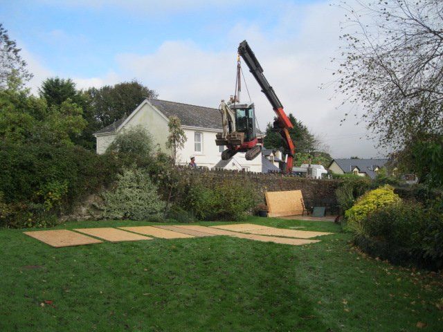 heavy machinery near a house