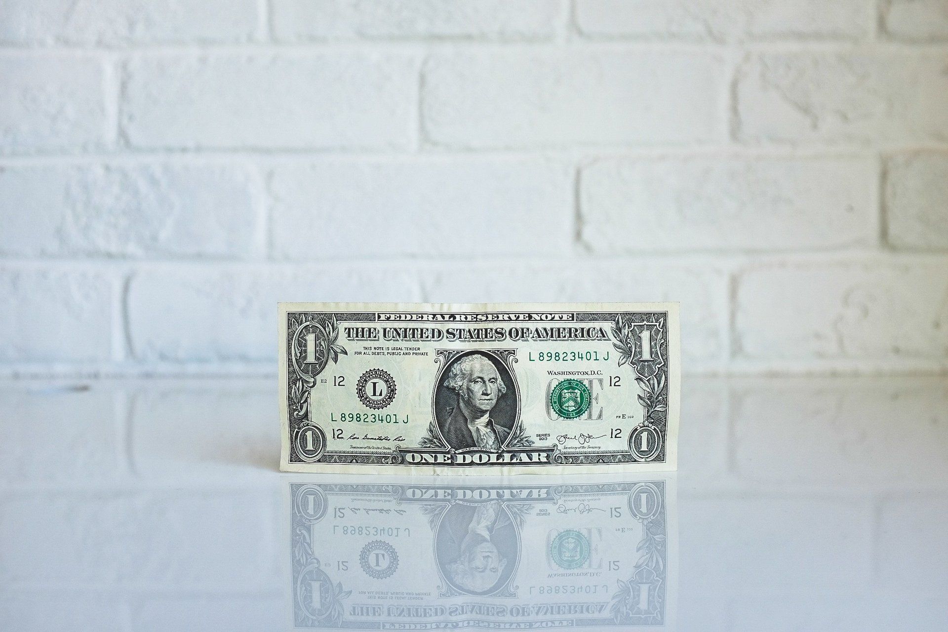 dollar bill with Washington's face imprinted on it