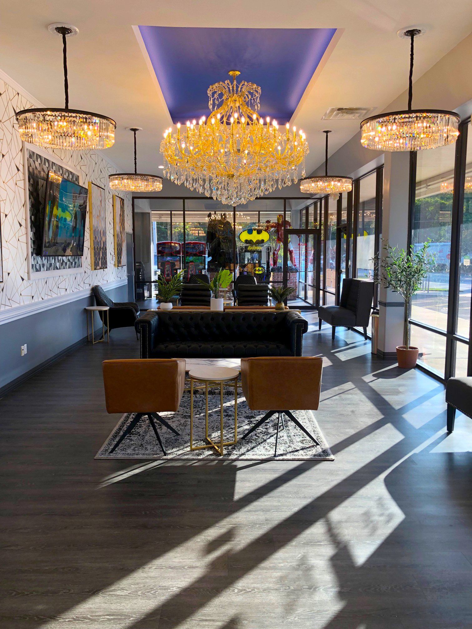 Lucent Dentistry in Austin Tx. A large lobby with a couch , chairs , and a chandelier.