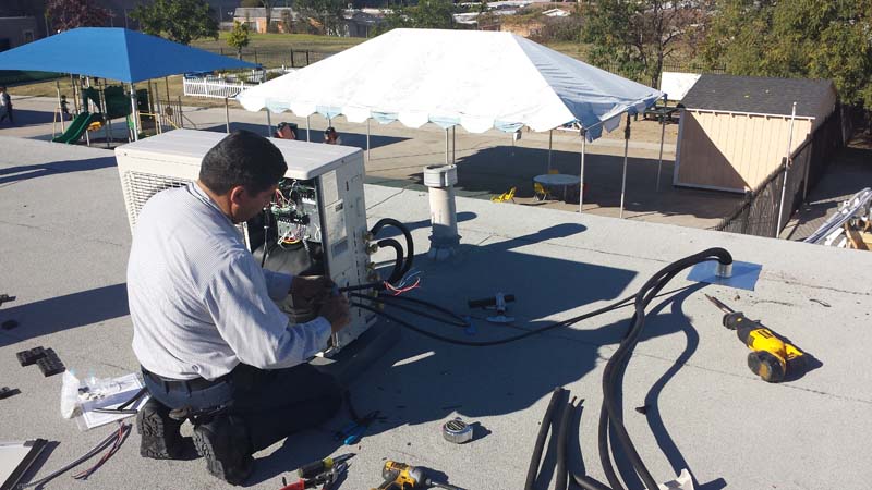 install_mini_split_condenser-on_roof