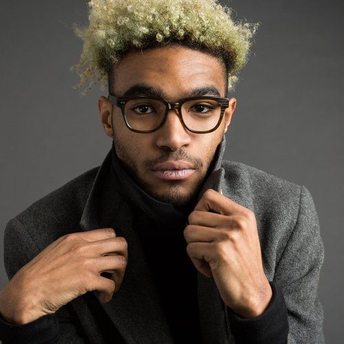 Person modeling a pair of eyeglass frames
