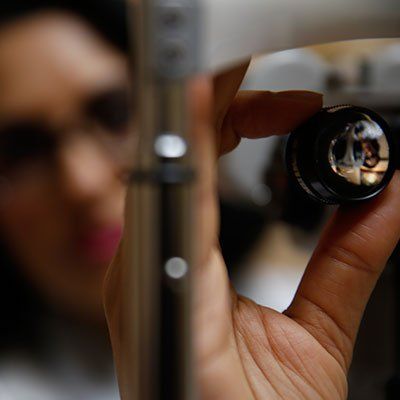 Blurred out image of a doctor adjusting a medical device