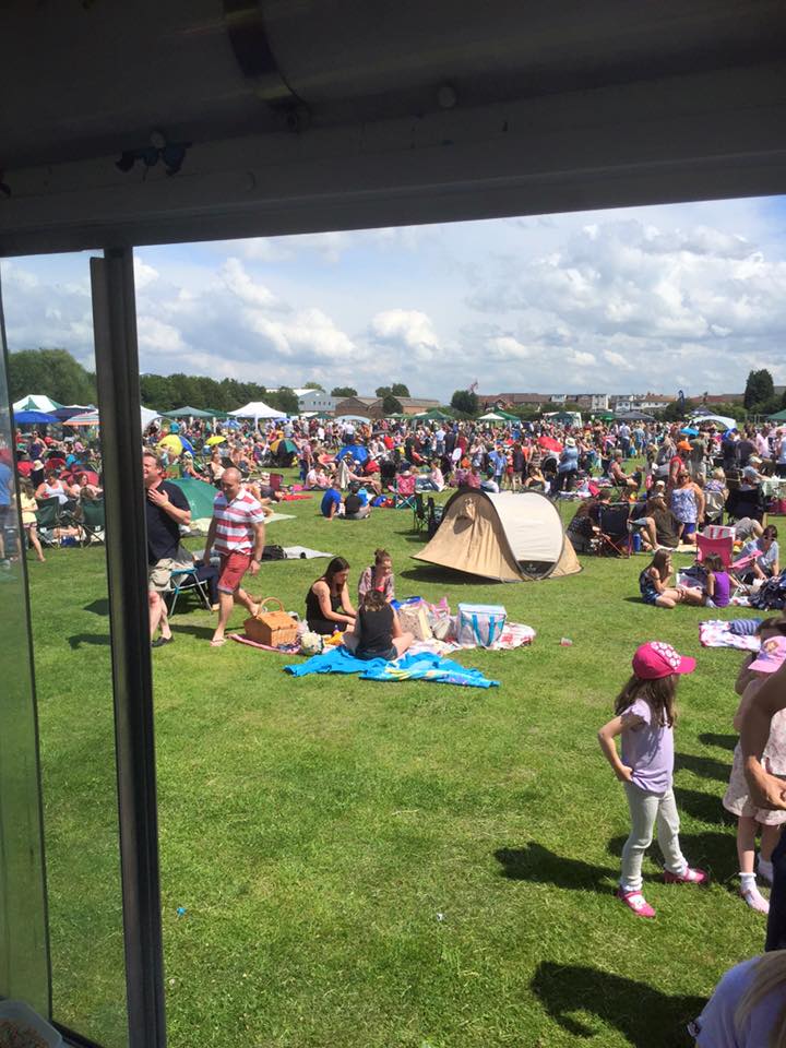 people sitting on a lawn