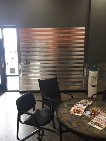 Bathroom Remodeling — Half Wall Installed With Diamond Plate Sheet Metal in Greenville, WI