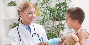 A doctor checking a child
