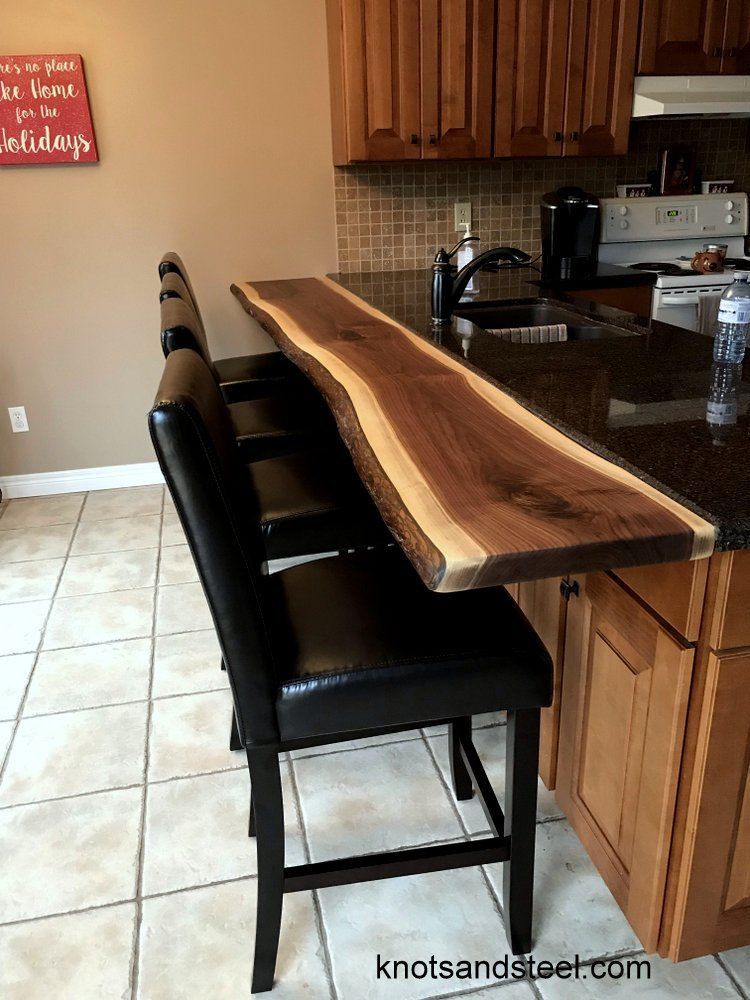 Breakfast bar in kitchen installation. Kitchen breakfast bar with mounting hardware.