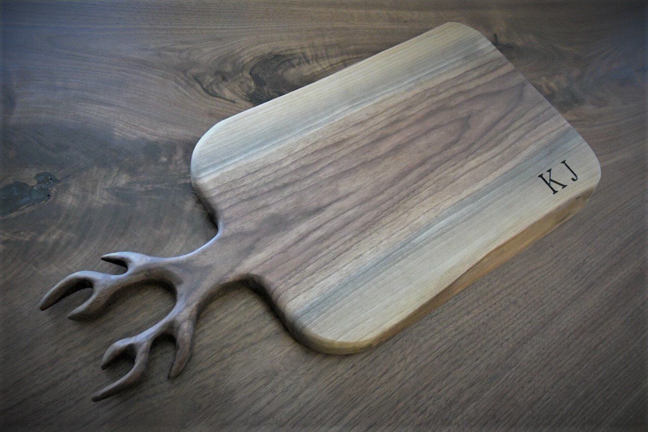 Antler cutting board Walnut serving board with antlers and engraving.