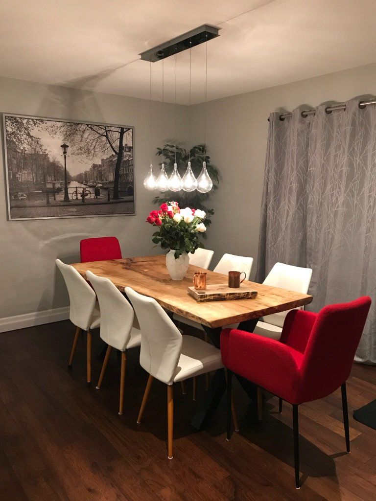 Dining room with live edge maple table by knotsandsteel.com Live edge Maple dining table with steel frame made in Canada.