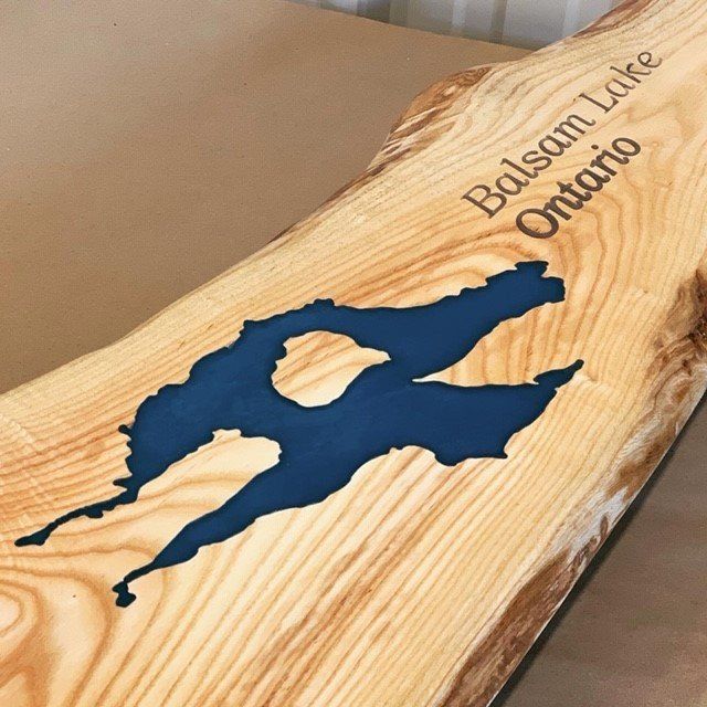 Personalized engraved cutting board with a live edge