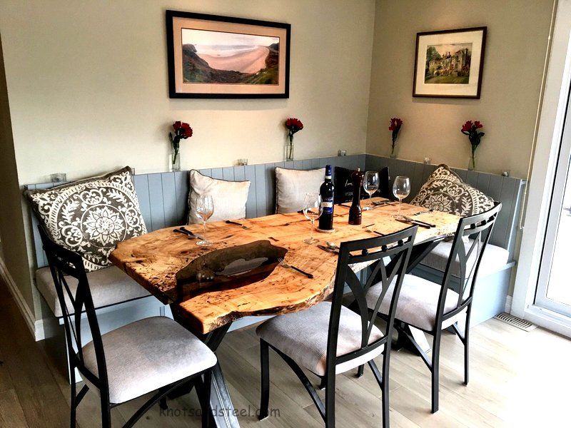 Natural live edge reclaimed table with tinted glass insert. Live edge dining table with glass inlay