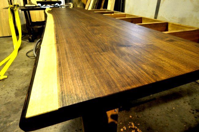 Bathroom vanity top made with a live edge wooden slab.