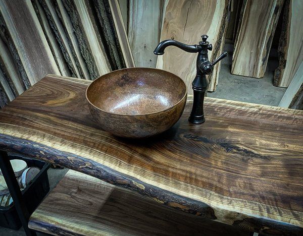 Vessel sink installed with live edge Walnut vanity Live edge bathroom vanity with copper vessel sink installed