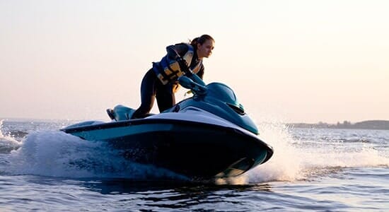 Woman enjoying jetski — Car Audio in Lemoyne, PA Woman enjoying jetski — Car Audio in Lemoyne, PA