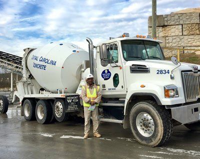 Man Standing Near The Truck — Greensboro, NC — Central Carolina Concrete, LLC Man Standing Near The Truck — Greensboro, NC — Central Carolina Concrete, LLC