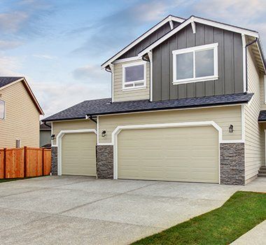 Garage Door Replacement — House Exterior with Two Garage Space in Chesapeake, VA Garage Door Replacement — House Exterior with Two Garage Space in Chesapeake, VA