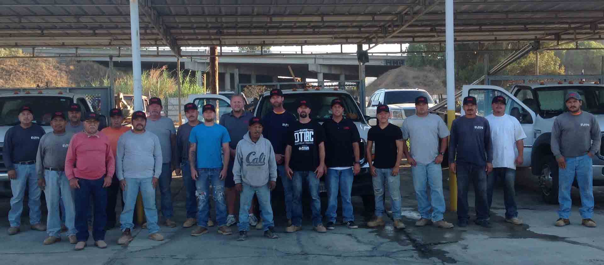 Men Standing Outside The Trucks — Riverside, CA — Elrod Fence Co