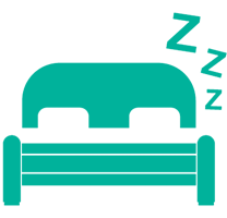 Teal bed with pillows and headboard;