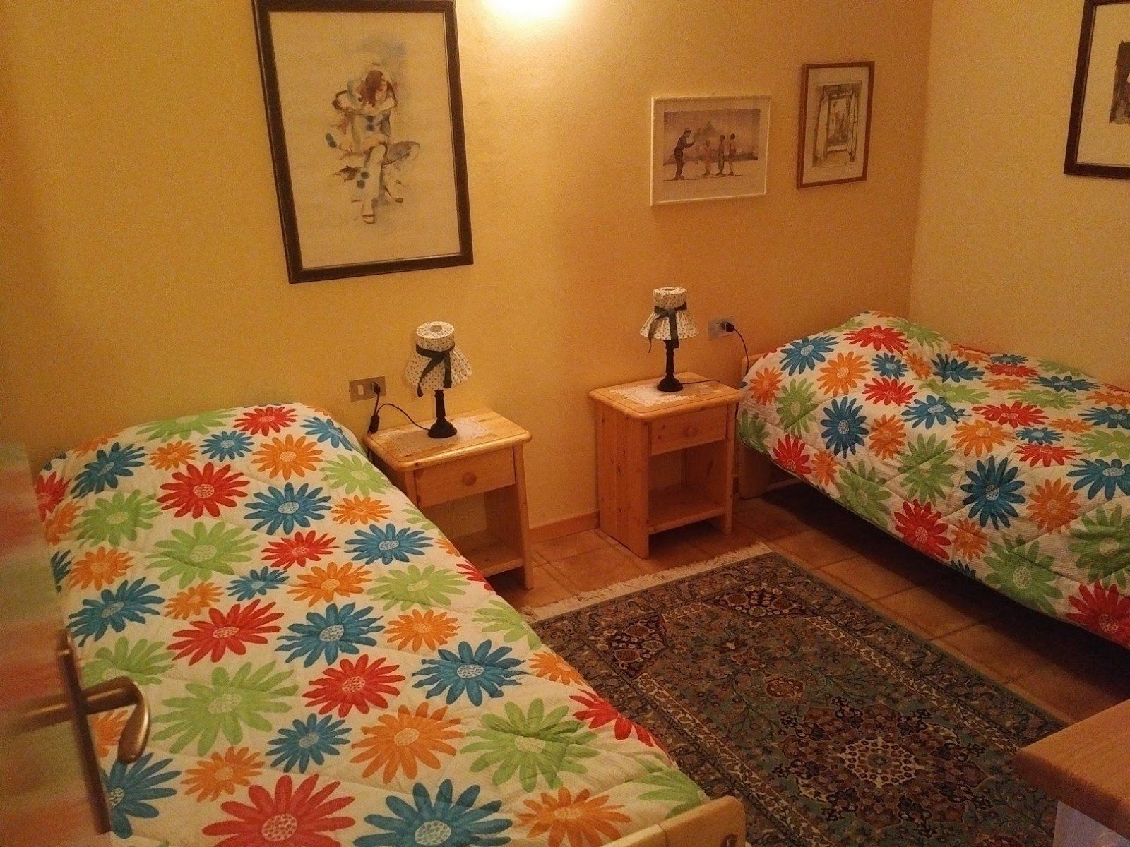 A bedroom with two single bed