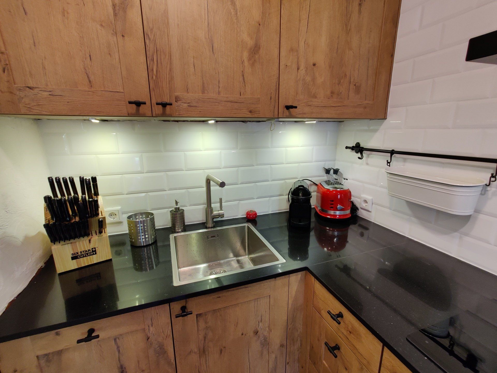 kitchen with appliances sink and knife set