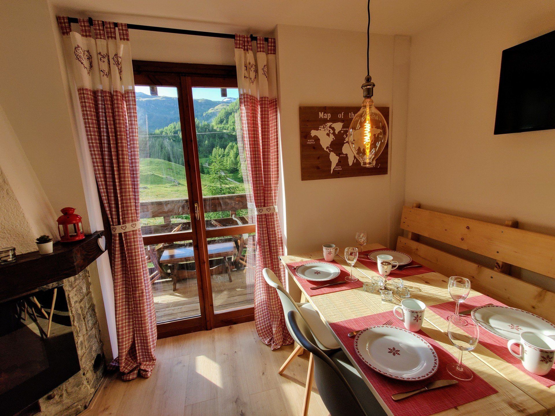 Living room with set table and mountain view
