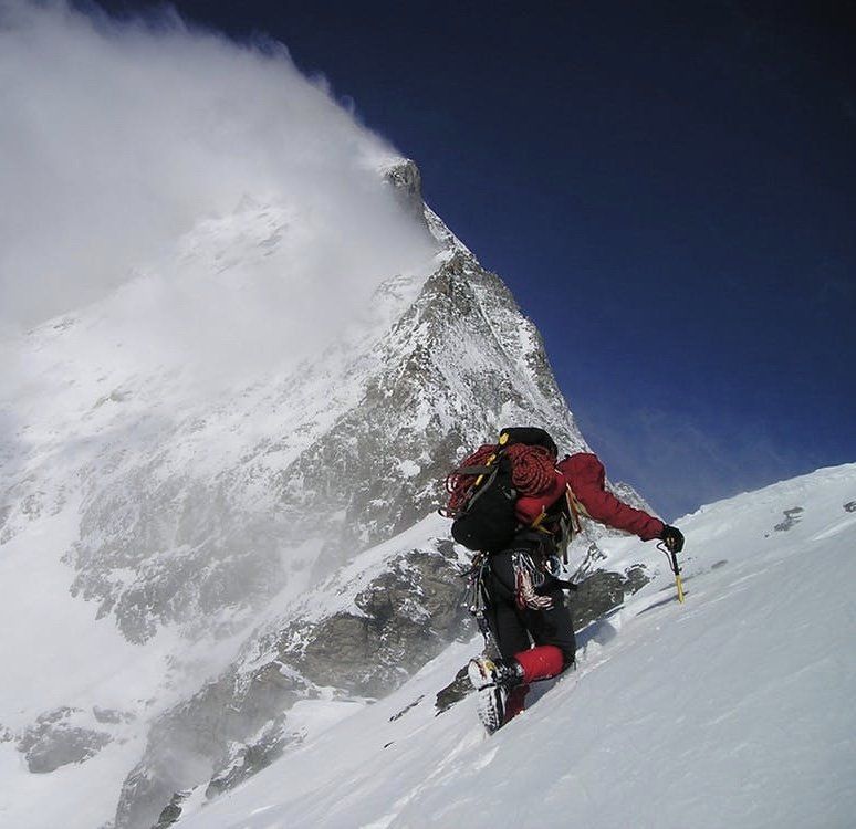 people walking with the Matterhorn in the back