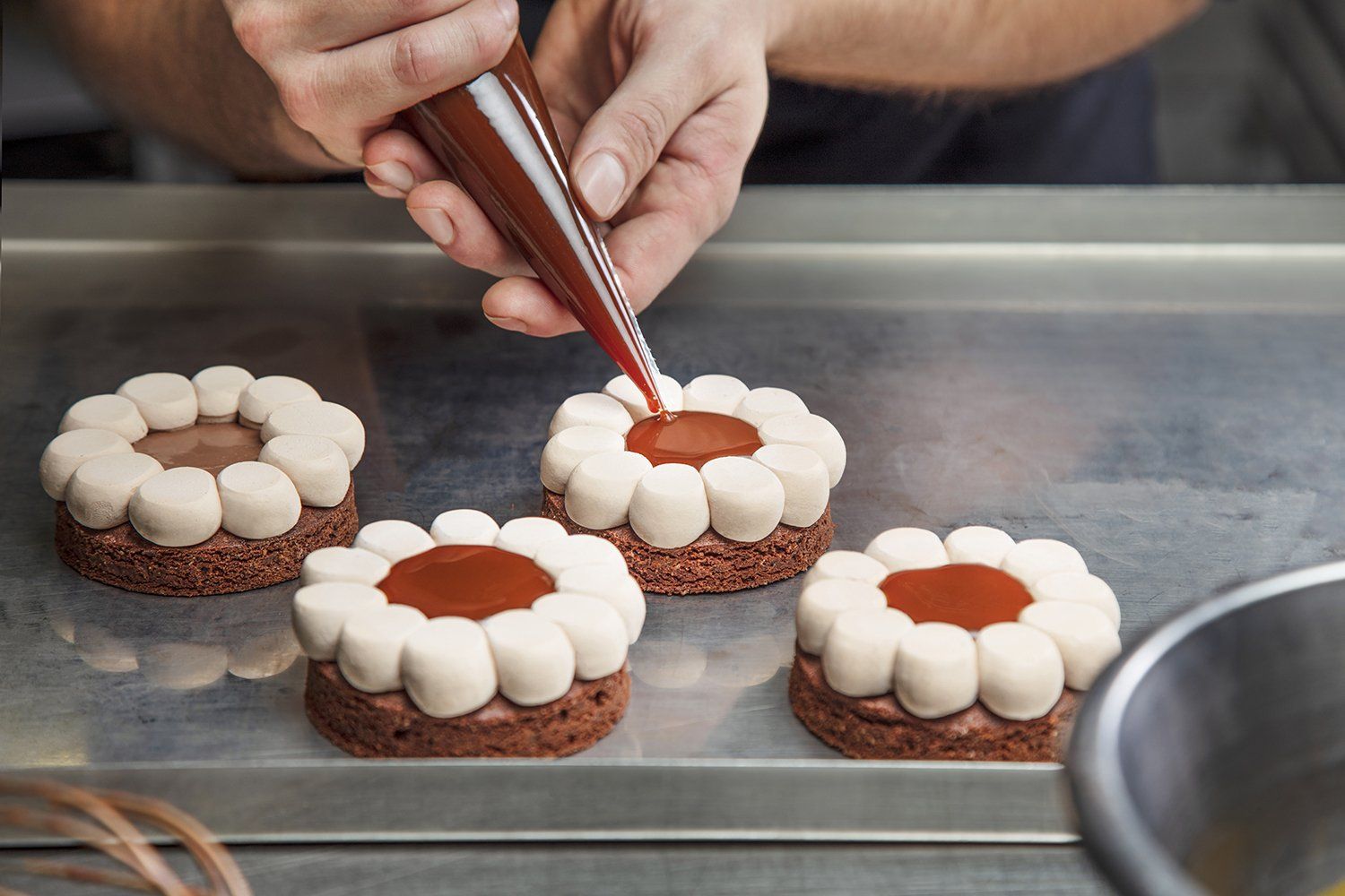 Guillaume Bichet preparing pastries in his Geneva laboratory. The art of pastry making by the Geneva artisan Guillaume Bichet