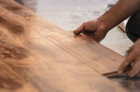a technician installing wooden frame