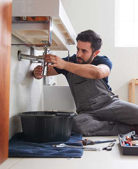 Plumber Fixing The Pipe Plumber Fixing The Pipe