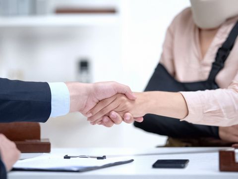 Shaking Hand To Woman With Injury — Oklahoma City, OK — Murphy & Murphy Attorneys Shaking Hand To Woman With Injury — Oklahoma City, OK — Murphy & Murphy Attorneys