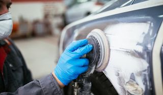 Collision Repair — Mechanic doing sandblasting In Cocoa, FL Collision Repair — Mechanic doing sandblasting In Cocoa, FL