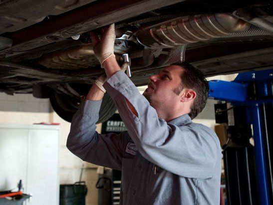 Land Rover Repair — Checking Car Engine Using Laptop in Modesto, CA Land Rover Repair — Checking Car Engine Using Laptop in Modesto, CA