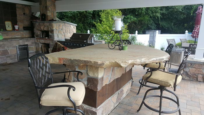 Outdoor Kitchen and Stone Dining Table — Red Lion, PA — Garden Creations LLC