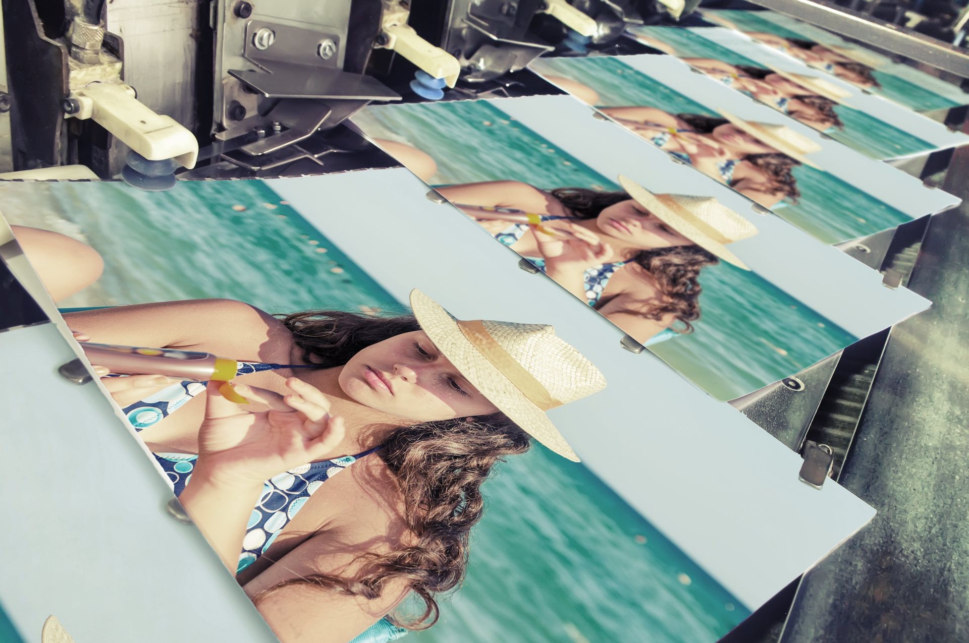 A machine is printing a picture of a woman in a bikini and hat