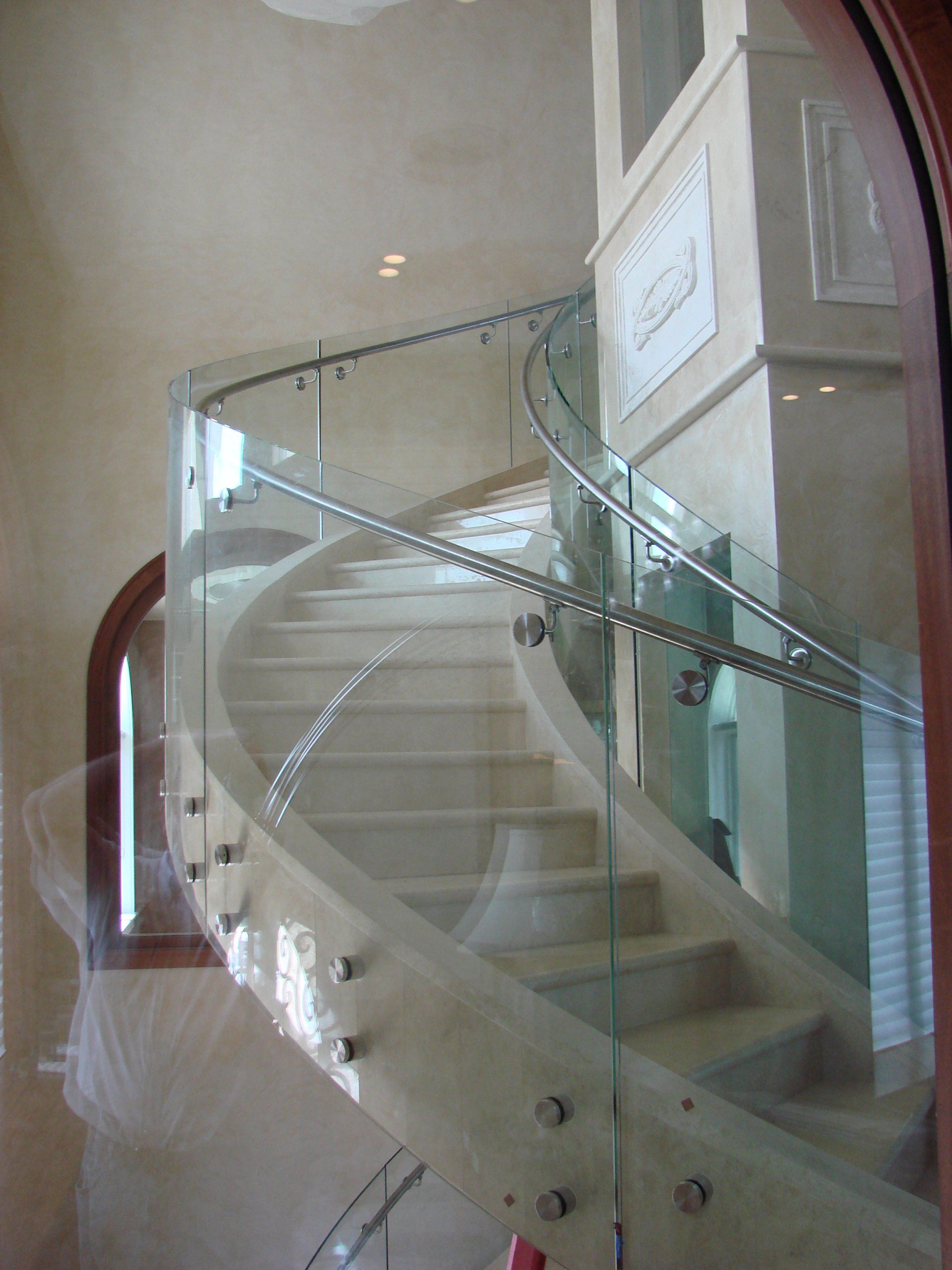 Bent glass for curved staircase handrail