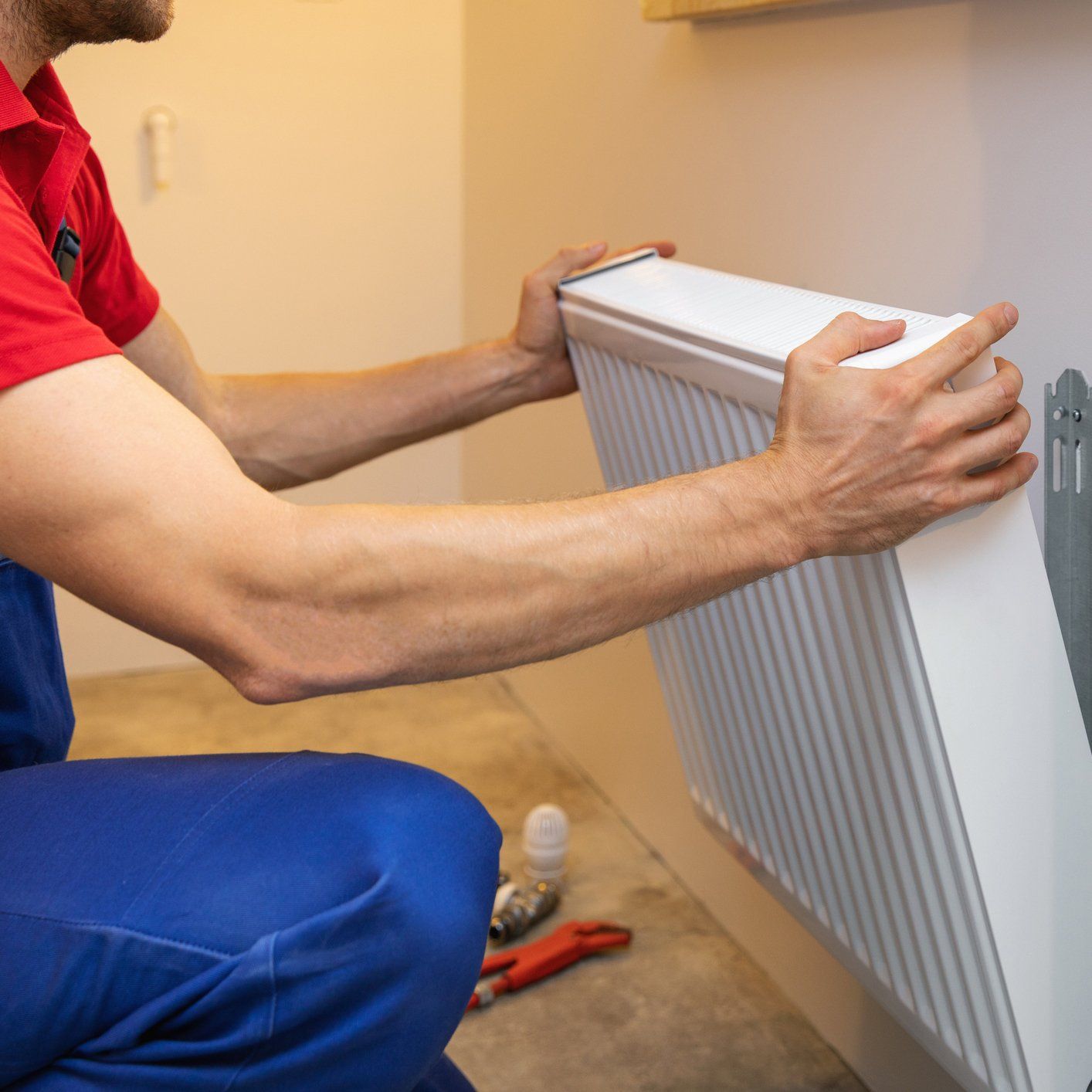 HVAC Services — Man Installing the Heater in Everett, WA