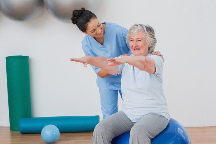 Extremity Practitioner — Senior Patient Exercising With With The Therapist in Modesto, CA Extremity Practitioner — Senior Patient Exercising With With The Therapist in Modesto, CA