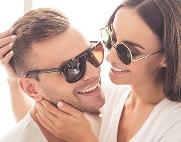 Couple Wearing Eyeglasses - Eye Care in Rocky Mount, NC Couple Wearing Eyeglasses - Eye Care in Rocky Mount, NC