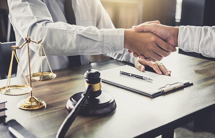 Attorney and Client Handshake — Louisville, KY — Connelly Kaercher Law Offices Attorney and Client Handshake — Louisville, KY — Connelly Kaercher Law Offices
