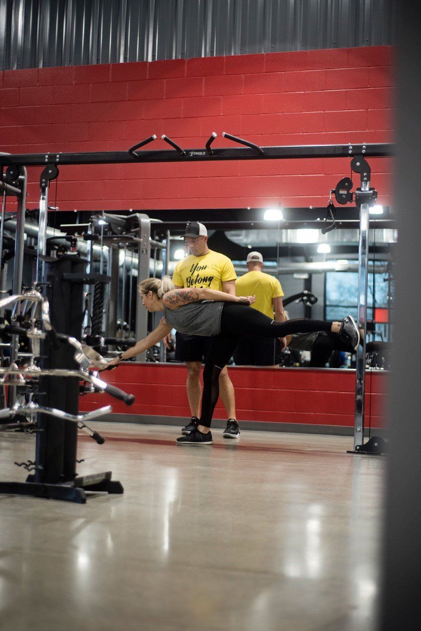 Fitness Training — Gym Trainer Guiding Girl on Lifting in South Zanesville, OH