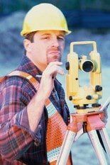 Man using Surveying Tool — Topographic Surveys in La Plata, MD Man using Surveying Tool — Topographic Surveys in La Plata, MD
