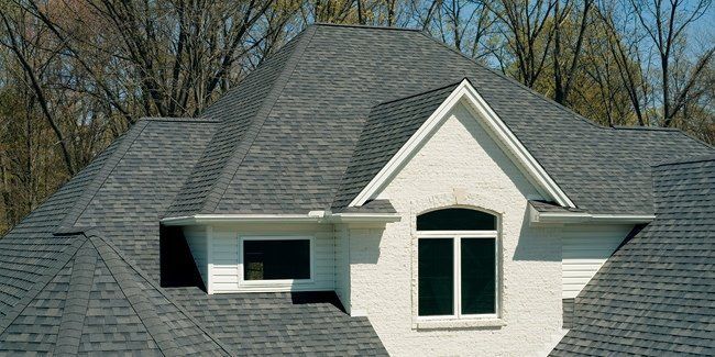 Professional worker installing residential roof — Indianapolis, IN — Rain-Flow Gutters Professional worker installing residential roof — Indianapolis, IN — Rain-Flow Gutters