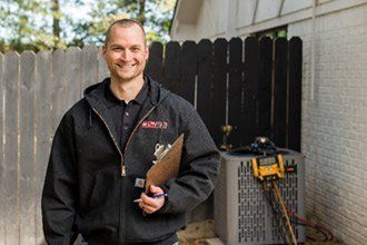 Smiling repairman - HVAC Services in Kernersville, NC