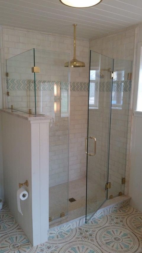 Glass Installation — A Shower enclosures With Gold Shower Hanging In The Sailing in San Antonio, TX Glass Installation — A Shower enclosures With Gold Shower Hanging In The Sailing in San Antonio, TX